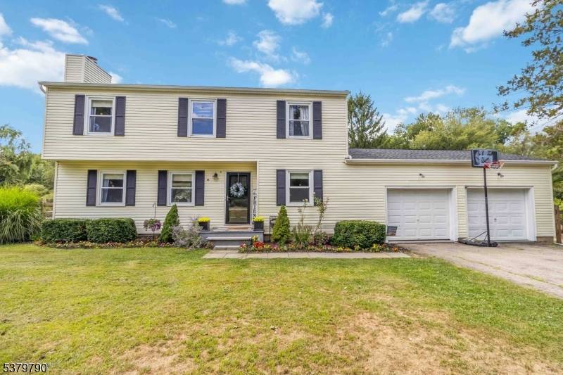 Set on nearly 1 acre in one of Long Valley's most sought after outdoor friendly neighborhoods, this 4 bedroom, 2.