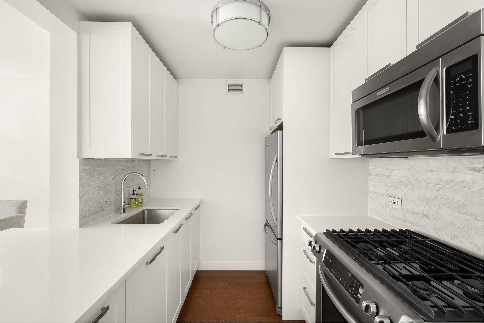 Spacious, sun flooded, one bedroom, one bathroom condominium with high end finishes, incredible building amenities and move in ready !