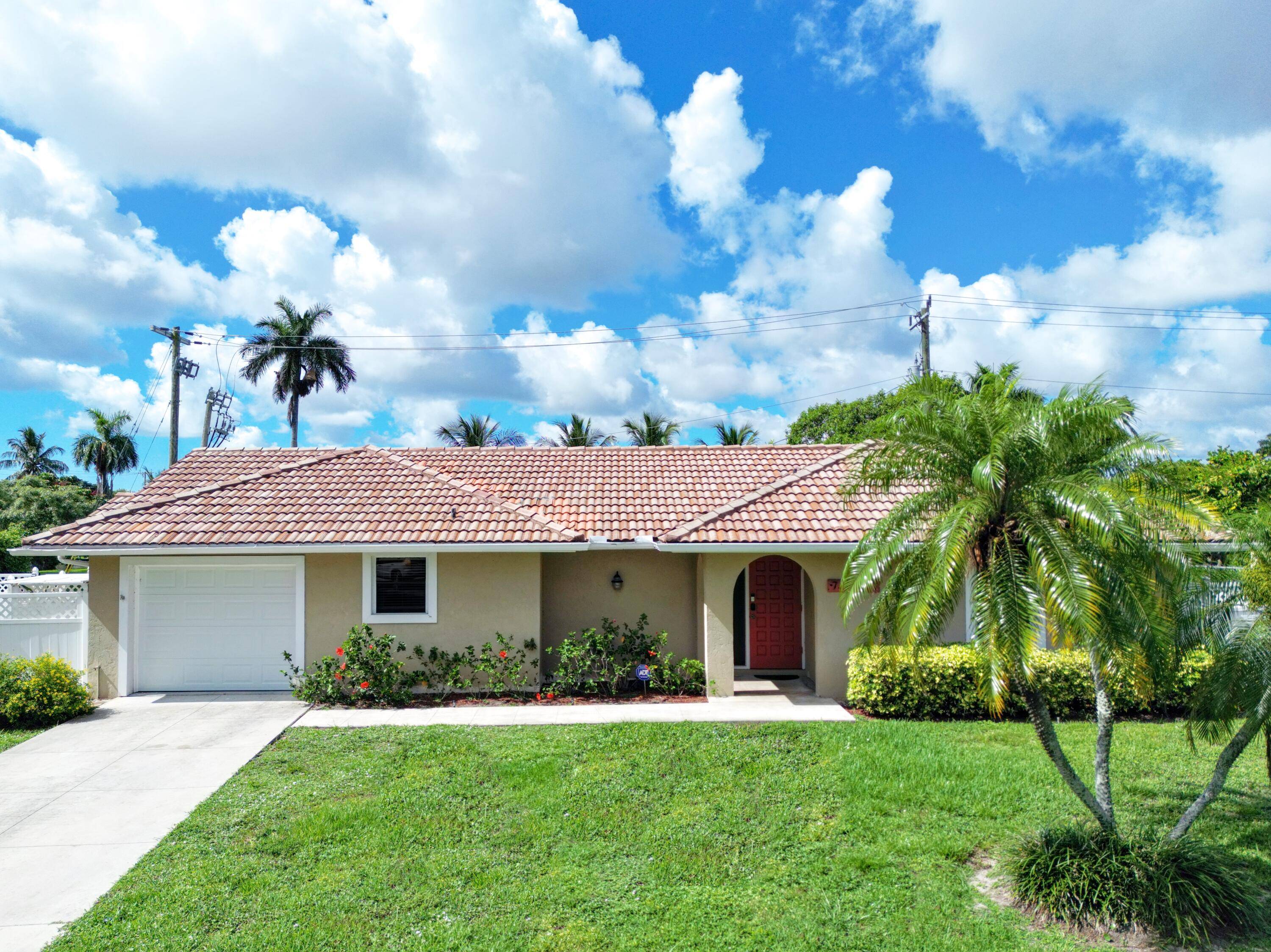 Welcome to your serene lakefront escape in Lake Clarke Shores, FL !