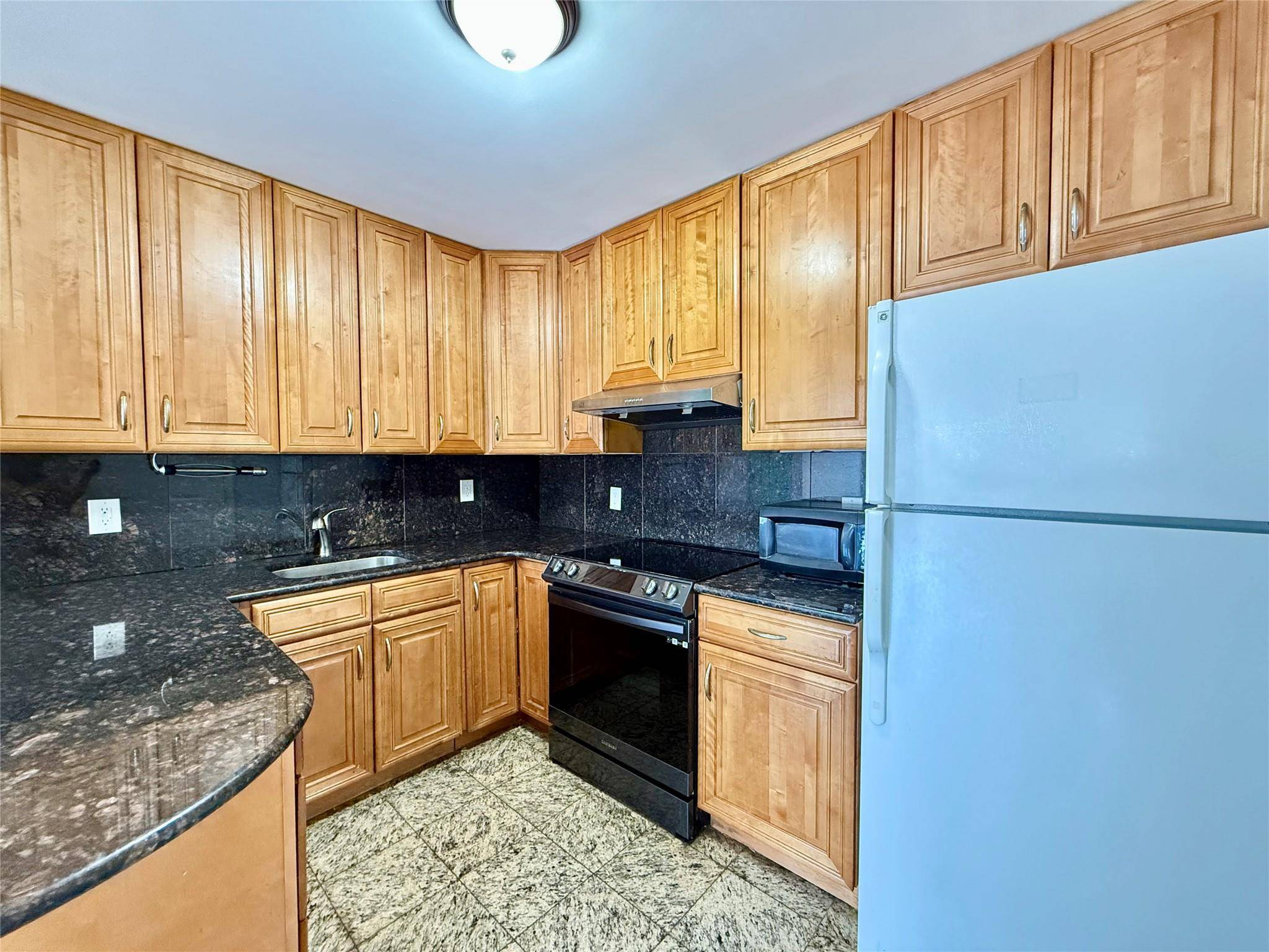 A well maintained 2 bedrooms, 2 bathrooms condo in Flushing, offering a bright, move in ready with central A C and heating, spacious bedrooms, and the convenience of an in ...