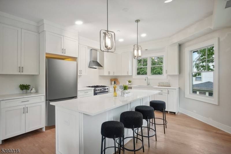 NEW CONSTRUCTION ! Superbly designed CUSTOM townhouse with fabulous open floor plan boasting high ceilings, modern bathrooms and oak hardwood floors throughout.