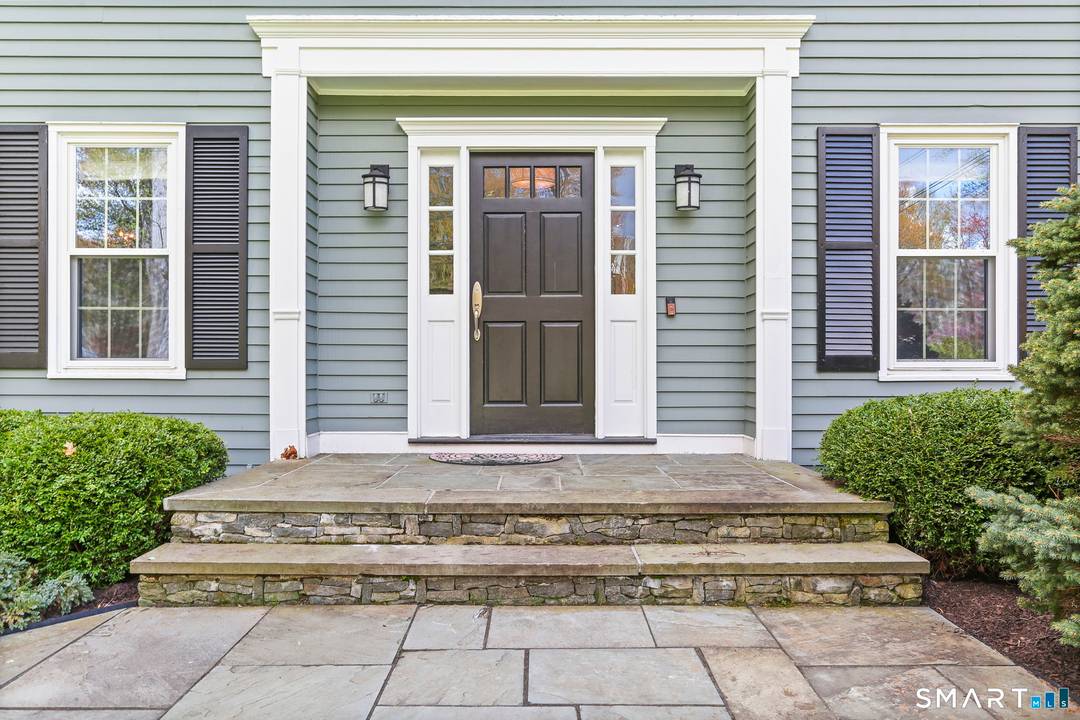 Welcome to 621 Shrub Oak Lane, a classic Colonial set on two private acres in Greenfield Hill.