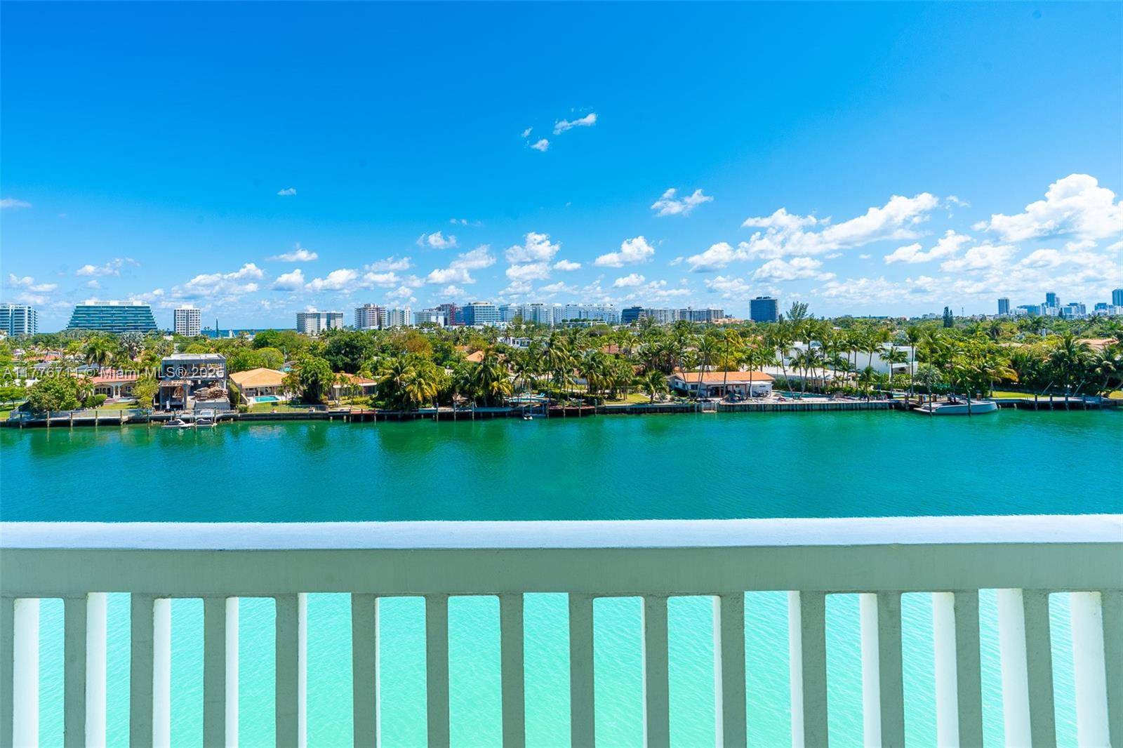 Experience luxurious waterfront living at 9111 East Bay Harbor Dr.