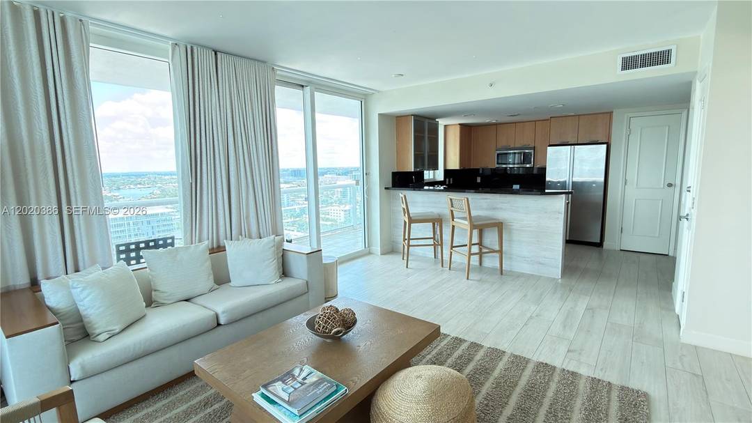 Spectacular corner condo at the prestigious Q Club Hotel at BEACH HOUSE A HILTON RESORT offering panoramic ocean, Intracoastal and city views from an oversized wraparound balcony.