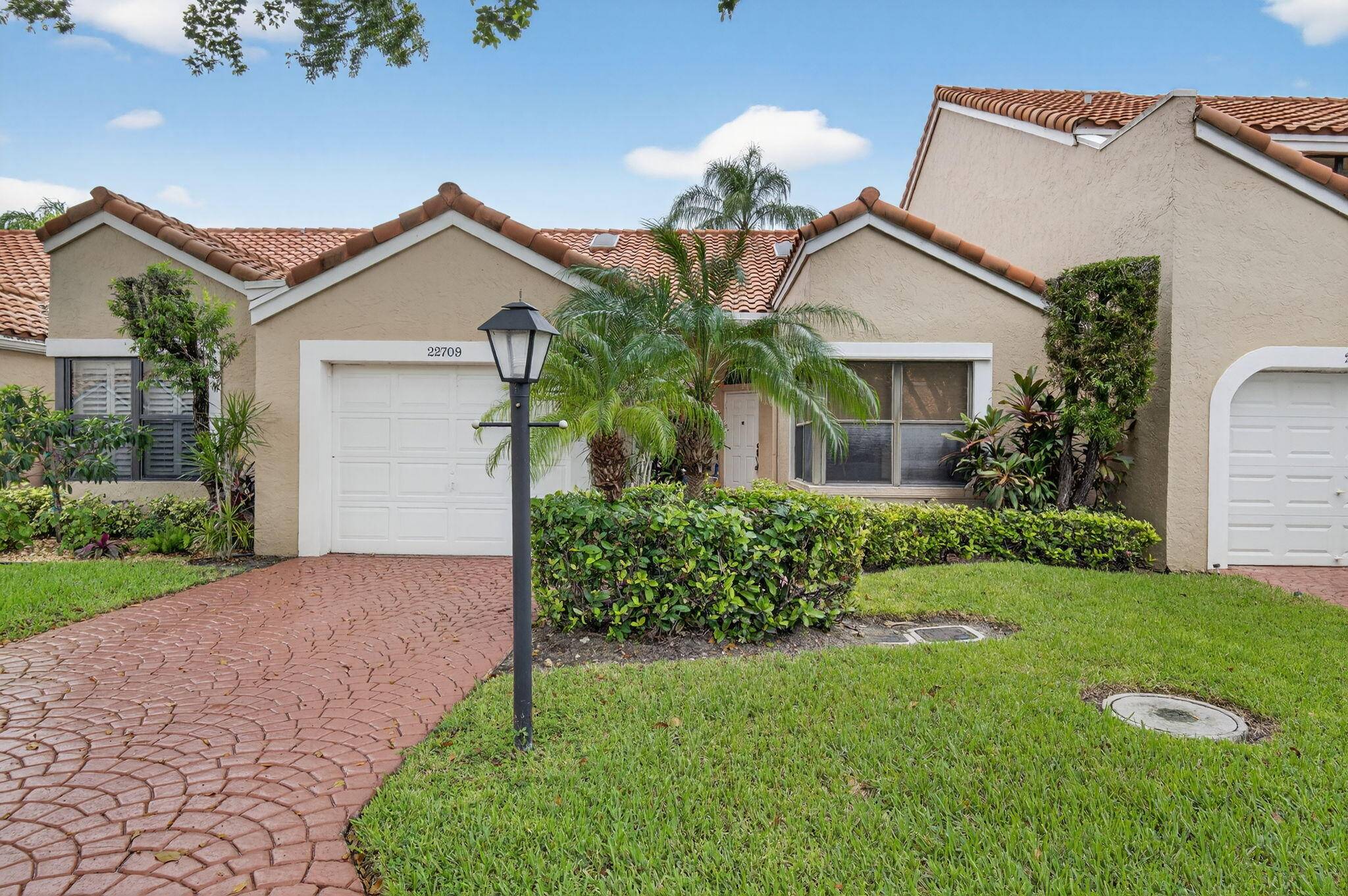 Spacious and inviting 2 bedroom, 2 bath villa with 1 car garage located in the highly sought after Meridiana at Boca Pointe.