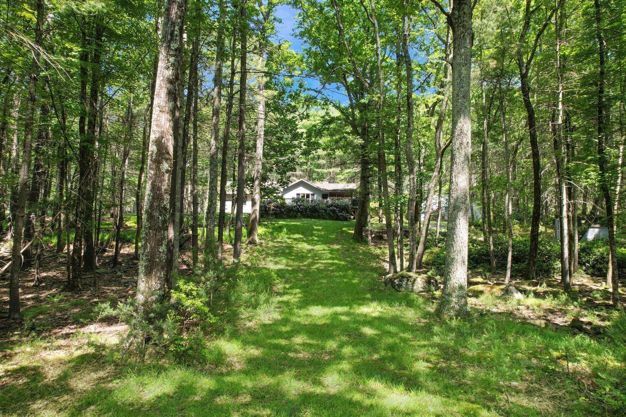 Discover serenity at this enchanting lakefront retreat on Mohican Lake.