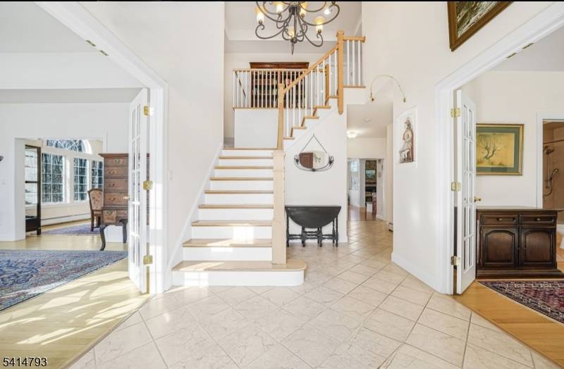 On 2. 84 private acres backing to protected land, this custom home offers privacy, space beautiful natural surroundings in a quiet neighborhood.