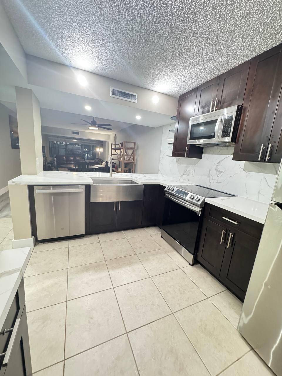 Beautifully renovated 2BR 2BA condo in desirable Whitehall with views of the clubhouse, gardens pool.