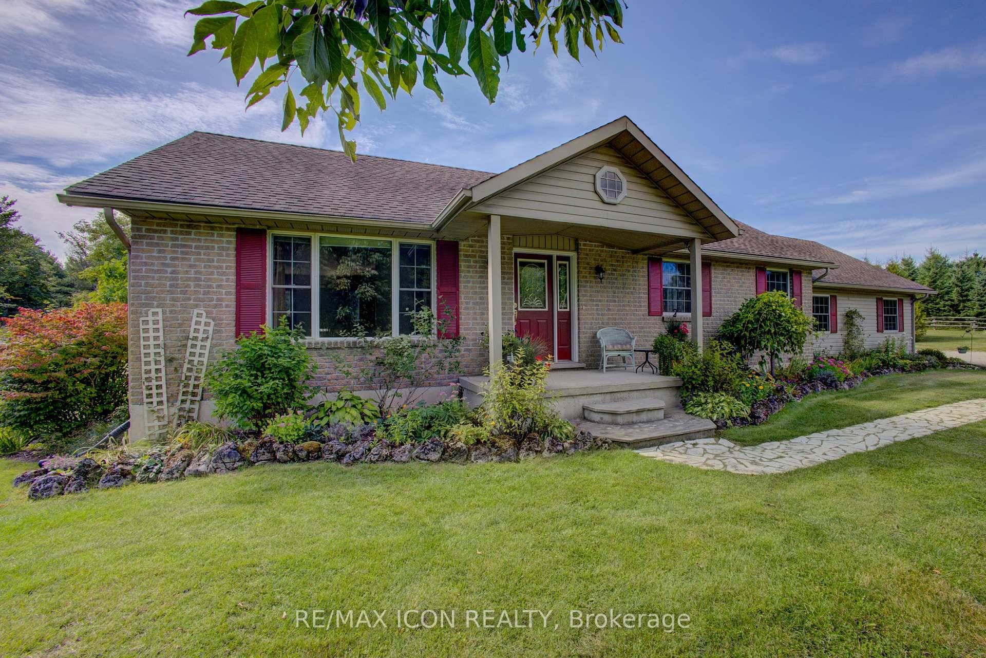 Welcome to this beautifully landscaped 3 bedroom, 2 bath country bungalow on over 2 acres with sweeping country views.