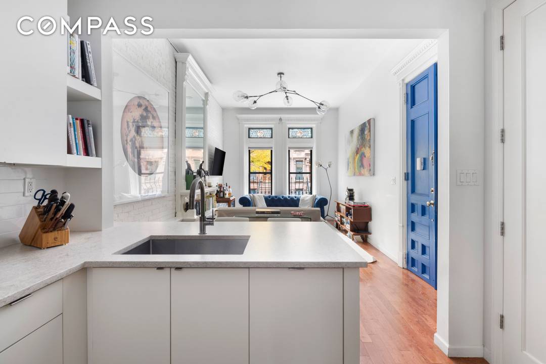 Manhattan s most compelling 1 bedroom condo under 1M complete with an extraordinary private backyard and no board approval.