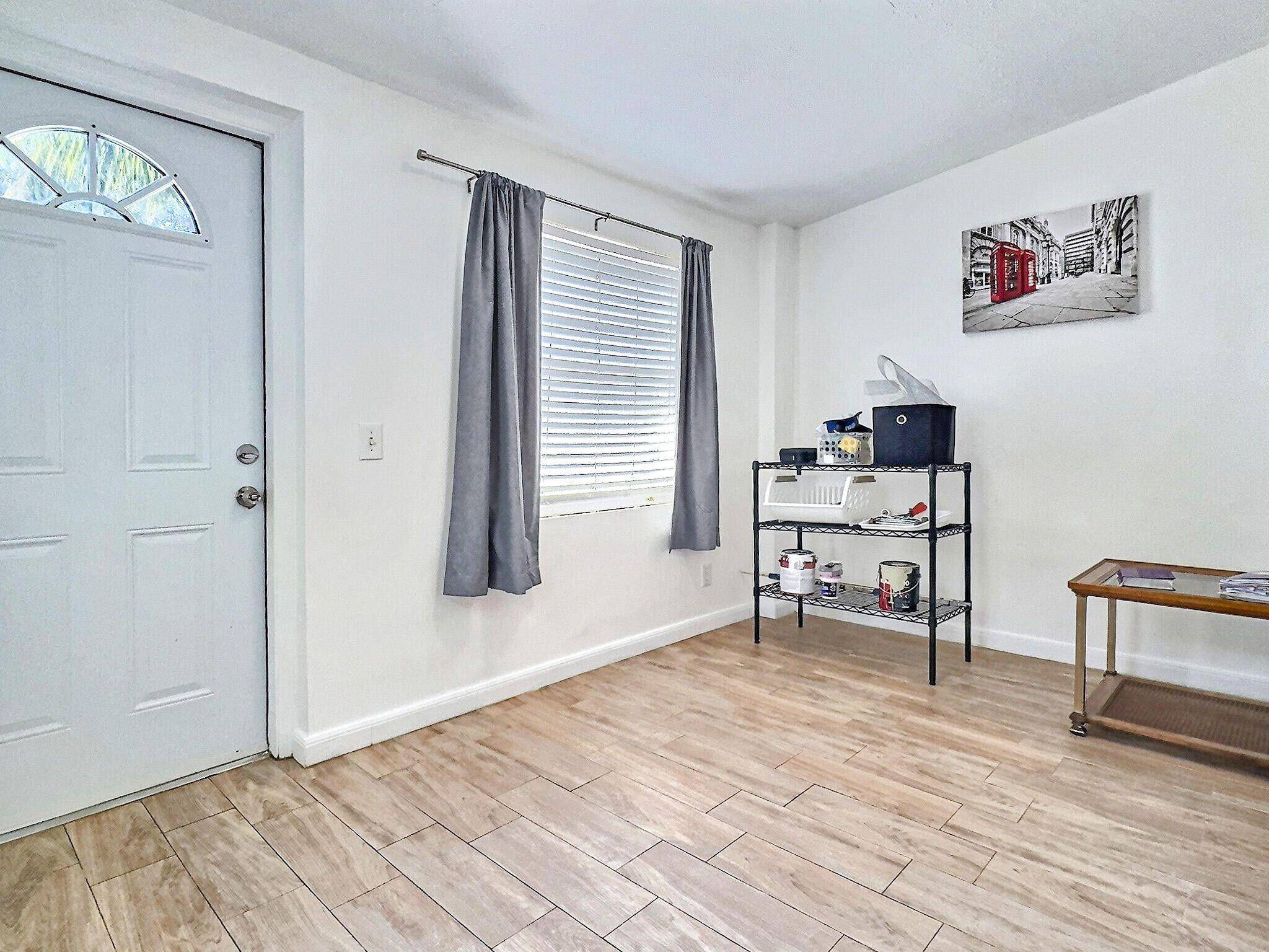 Discover this charming 2 bedroom, 1 bath home nestled on a picturesque tree lined street in Lake Worth Beach !
