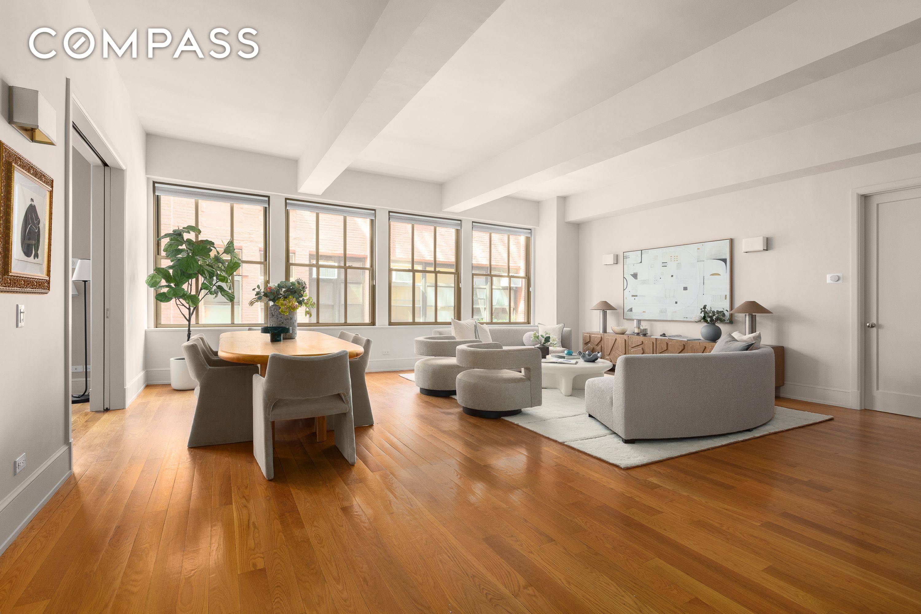 A palatial and voluminous three bedroom, three bathroom loft like residence boasting eleven foot beamed ceilings and extraordinary scale throughout in the Cass Gilbert Condominium.