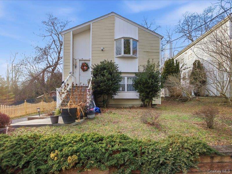 Welcome to this centrally located high ranch in the heart of Port Jefferson, set on a quiet dead end street just moments from village amenities, dining, shopping, and waterfront attractions.