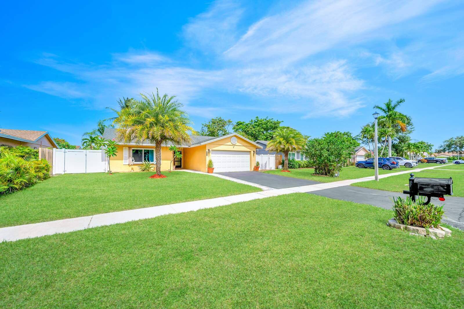 WOW ! Super Spacious Single Family Home Features 3 Bedrooms, 2 Bathrooms, a 2 Car Garage, Huge Sparkling POOL and amazing backyard located in Saddlebrook Spanish Isles !