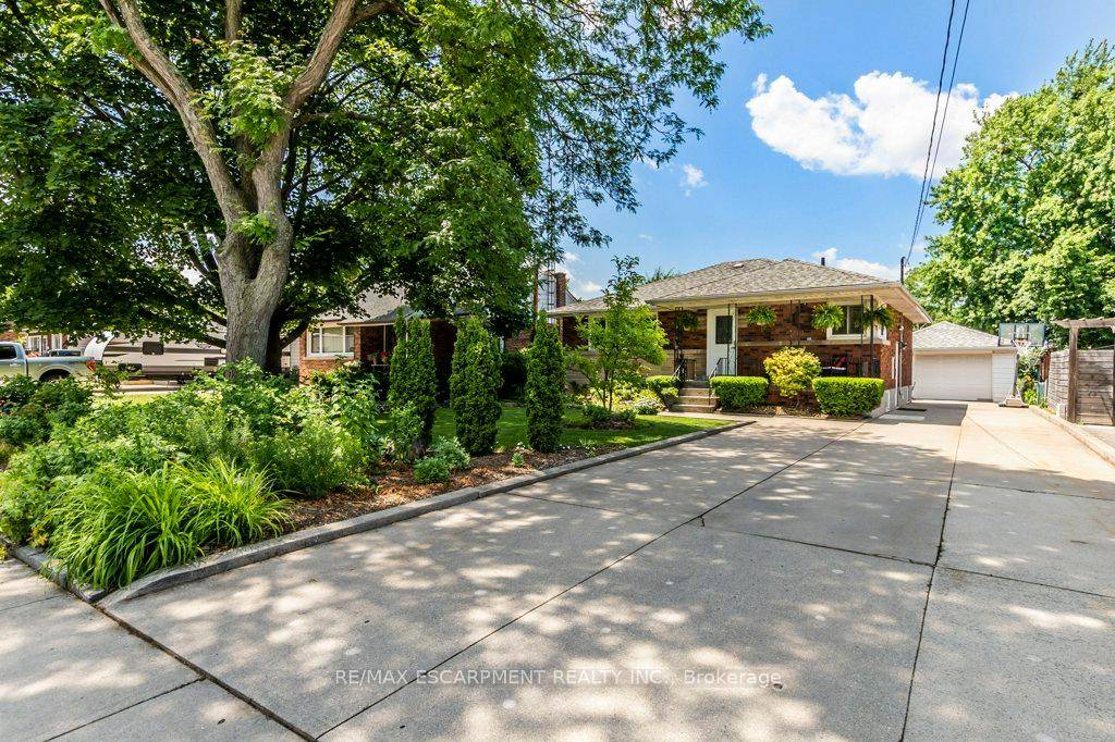 Welcome to this beautifully renovated and move in ready 3 1 bedroom, 2 bathroom 2 kitchen bungalow, ideally situated on a Huge private, professionally landscaped lot in one of Hamiltons ...