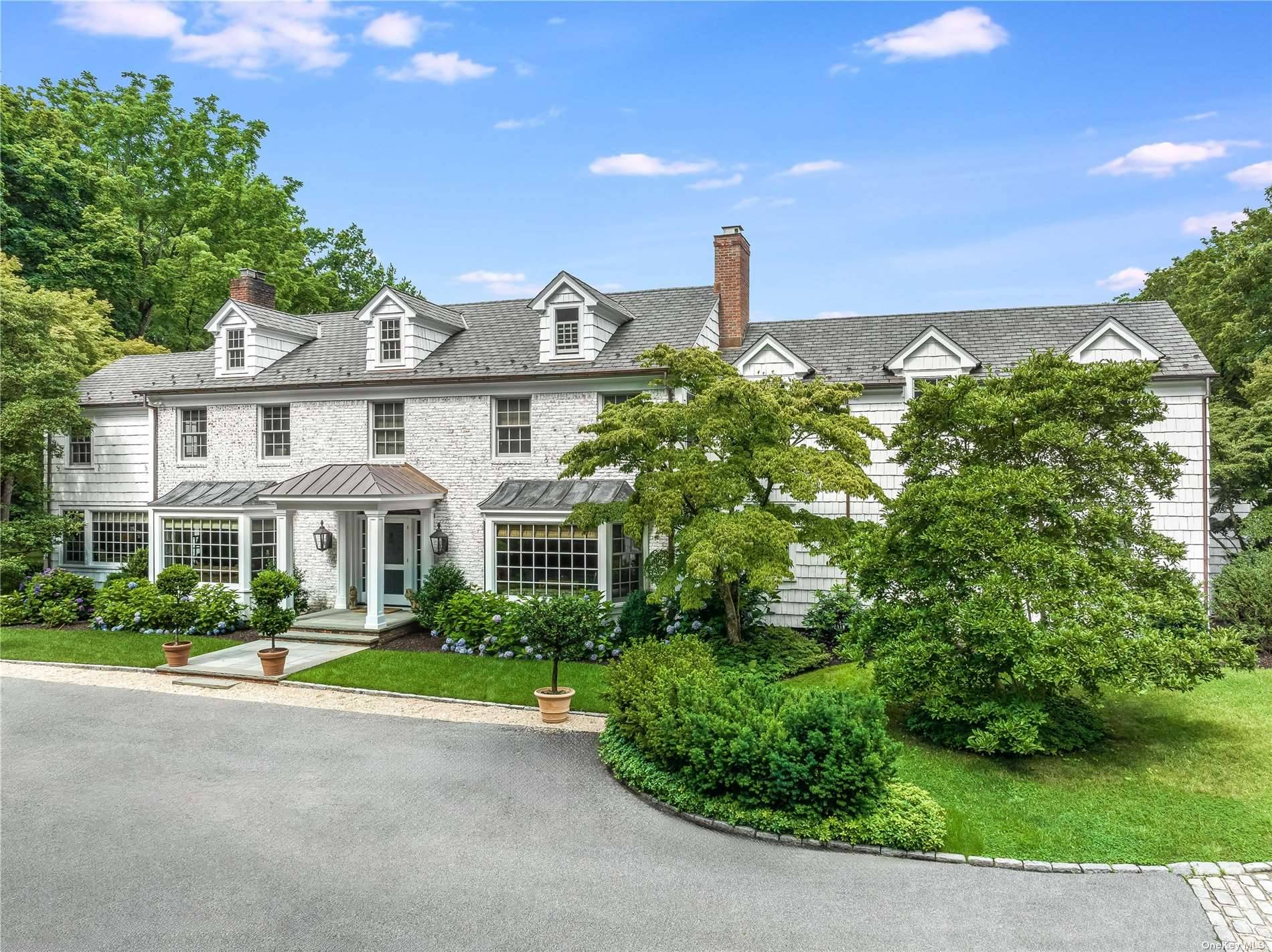 Lattingtown, NY Just thirty miles east of Manhattan, a quiet private road opens to this gracious completely renovated and expanded six bedroom Colonial estate featuring a sparkling new in ground ...