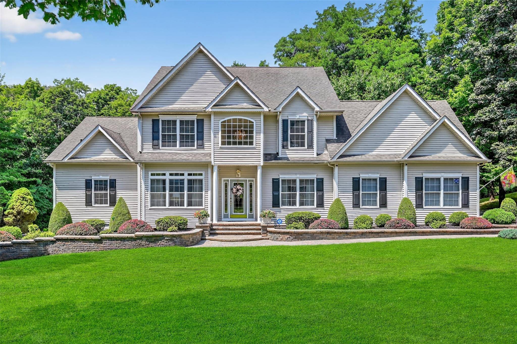 Step into elegance ! This exceptional and sophisticated custom home sits on a tree lined street in one of Balmville's most coveted neighborhoods.