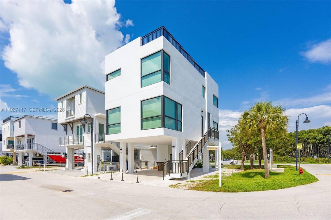 Experience luxury coastal living at its finest in this exceptional corner residence located in the highly sought after Key Largo Ocean Resort.