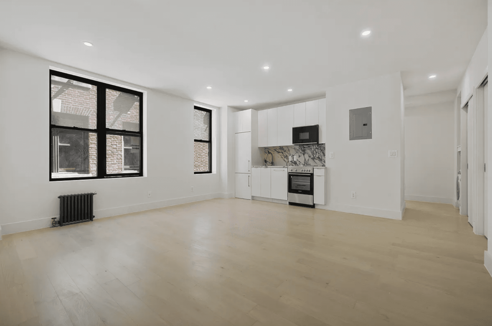 Beautifully gut renovated 2 bedroom, 1 bath residence featuring a stunning large kitchen with stainless steel appliances, wide plank Oak flooring, spacious bedrooms and in unit washer dryer.