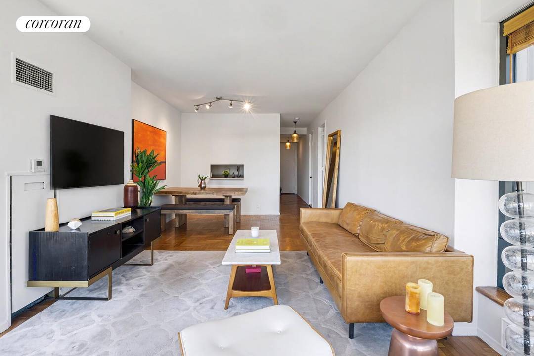 Situated on a high floor at Central Park Place, Residence 17B is a spacious one bedroom, one and a half bathroom home with open city views.