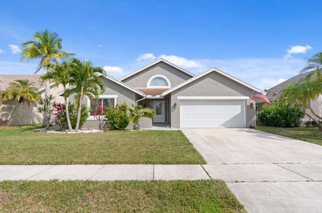 Welcome to this beautifully updated 3 bedroom, 2 bathroom home in the highly sought after Boca Winds community.