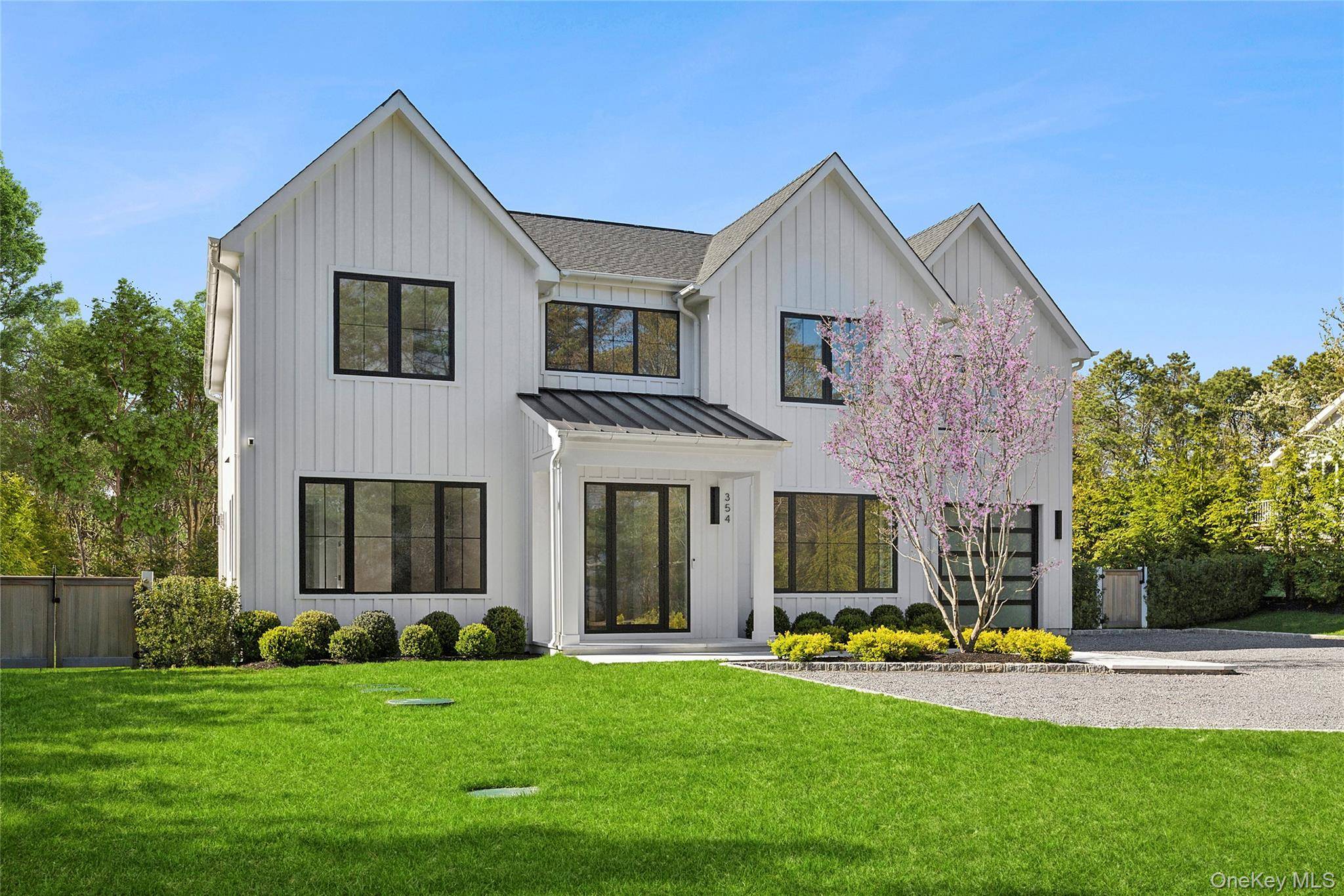 Just finished and introducing this magnificently sleek and sunny transitional country home that is abounding with modern flair.