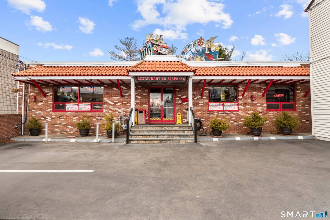 61 Cedar Street, Norwalk presents a rare mixed use investment opportunity featuring a well known Colombian restaurant along with a fully occupied residential building on the same property.
