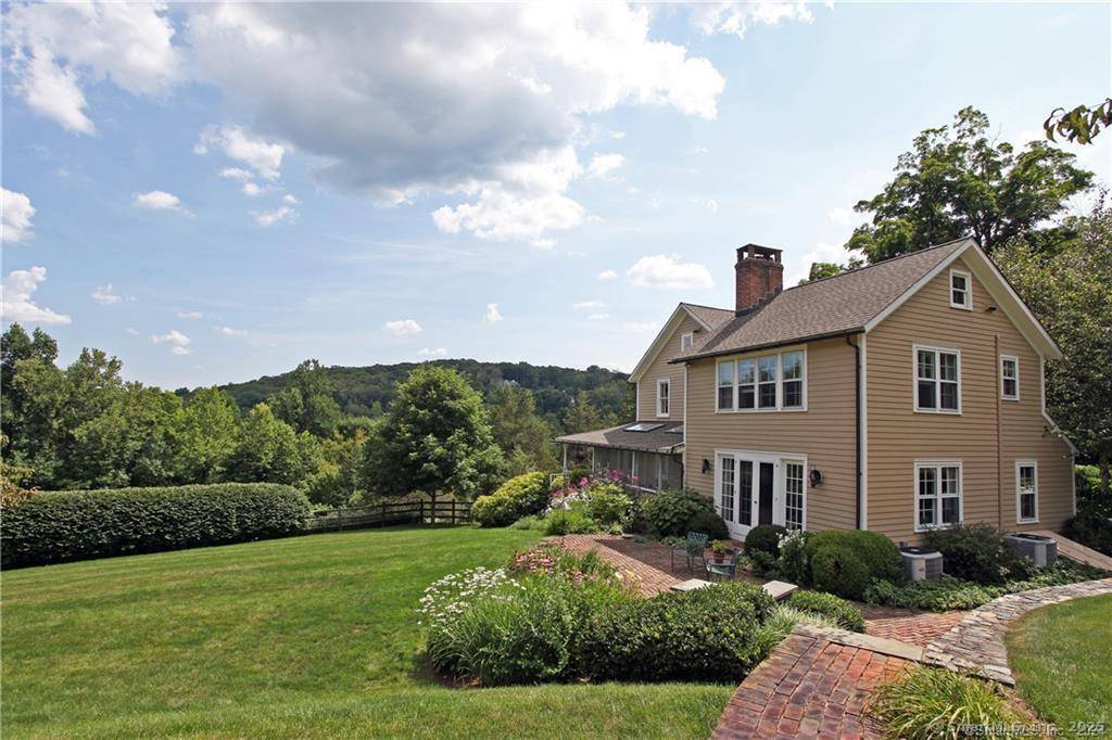 Beautifully restored and updated antique farmhouse with inground pool, cabana, guest house, tennis court and pond.