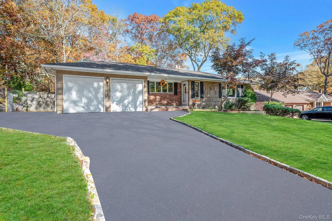 Discover This Inviting Ranch Style Home In The Desirable Half Hollow School District.