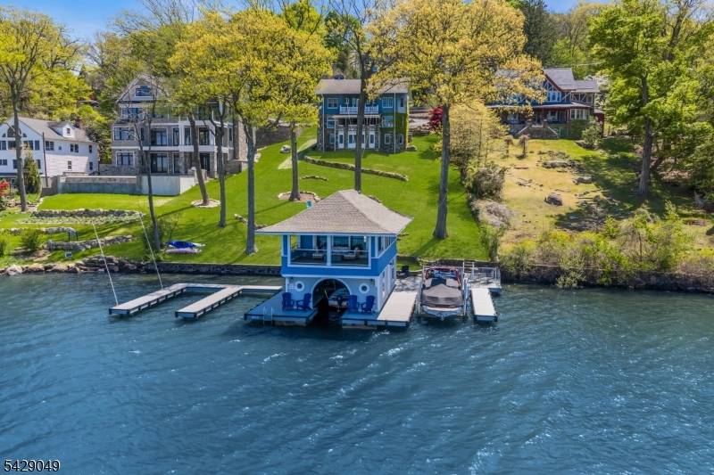 Built circa 1904 as a summer retreat by Gustav Stickley, this extraordinary Lake Hopatcong estate is one of only three privately owned Stickley designed homes known in New Jersey.