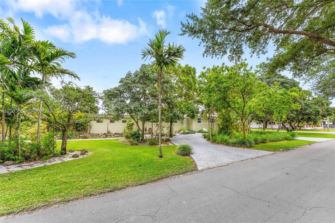 Welcome to 501 Lawn Way in Miami Springs, a beautifully maintained residence where timeless character meets thoughtful upgrades and effortless South Florida living.