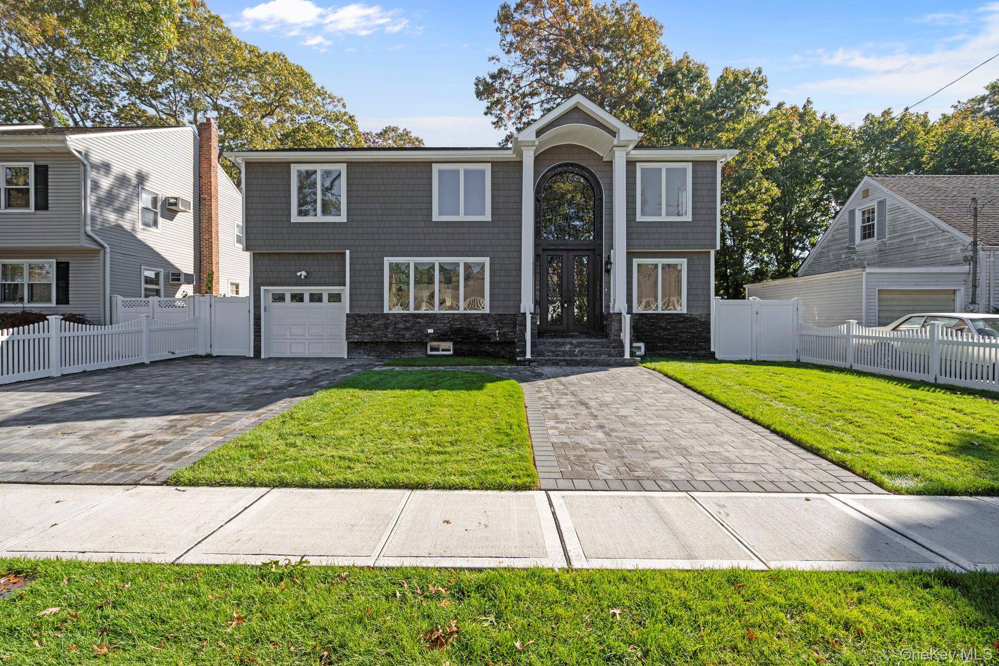 Welcome to this spectacular, fully renovated 5 bedrooms, 5 bathrooms Colonial Style in the desirable Massapequa Park Village.