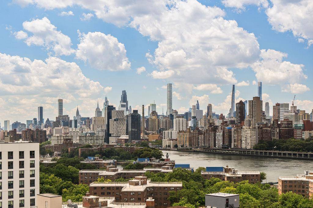 ONE OF A KIND ! Stunning corner 2 bedroom with a wraparound view showcasing the iconic Manhattan skyline.