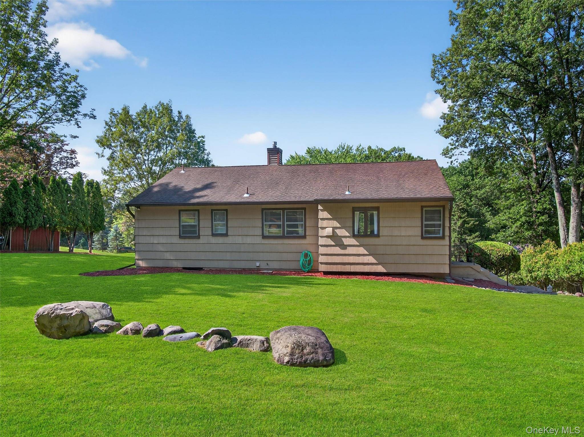 Nestled on a tranquil tree lined street, this delightful 3 bedroom ranch home offers an exceptional opportunity for comfortable living amidst nature's beauty.