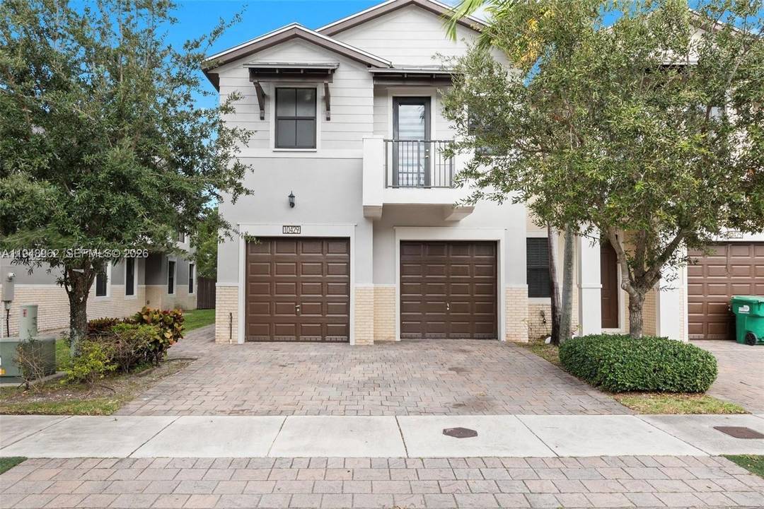 Stunning 4 bedroom, 3. 5 bath townhome in the exclusive, 24 hour gated community of Doral Cay.
