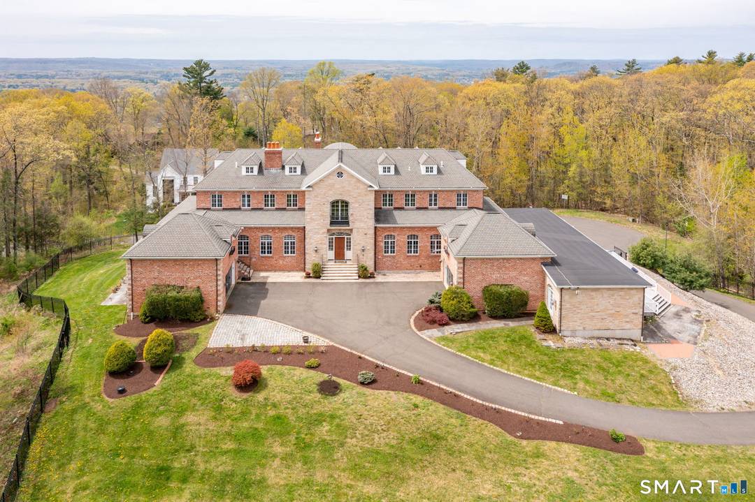 Introducing a remarkable brick estate perched atop Avon Mountain in Avon.