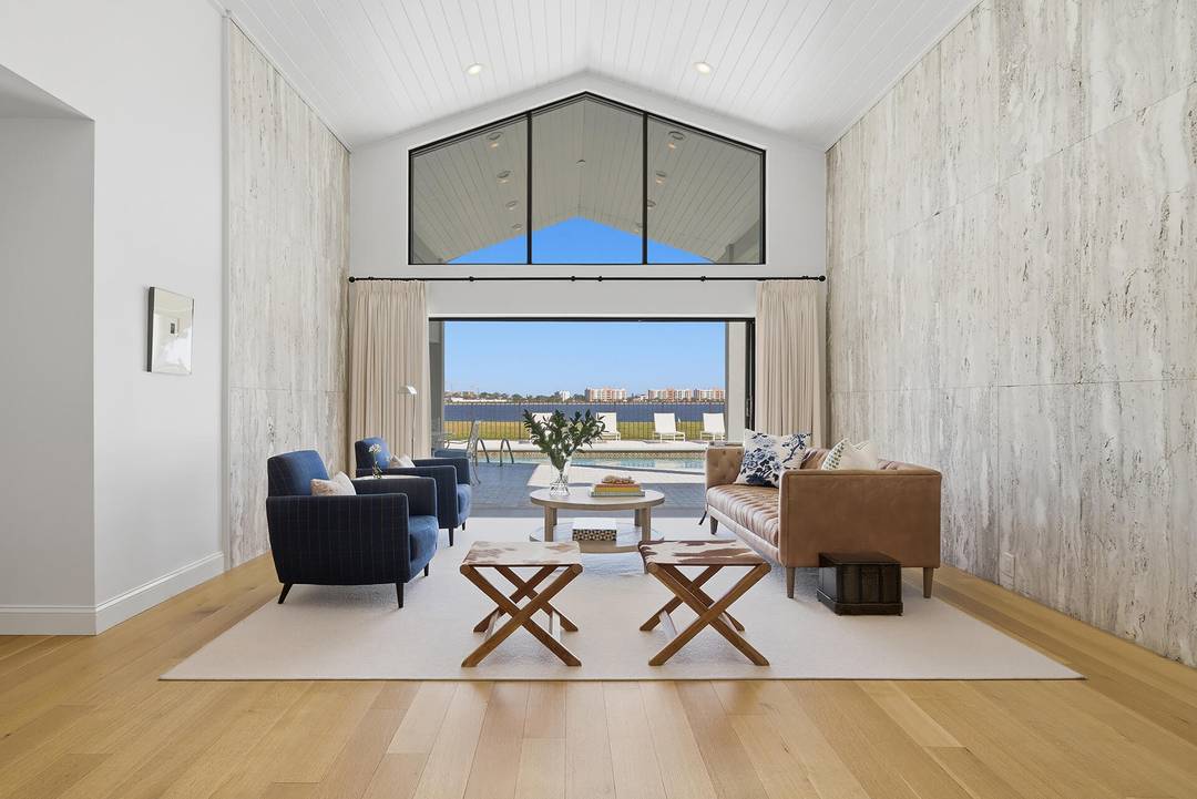 As though right out of the pages of Architecture Digest, Lakefront Luxury within a secure, 24hr gated community in the heart of West Palm Beach !