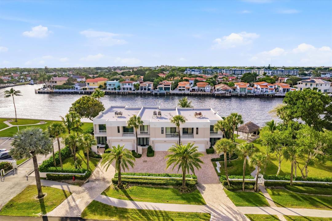 Experience refined coastal living in this rare, fully renovated Intracoastal end unit townhome one of only three exclusive residences in Trafalgar.