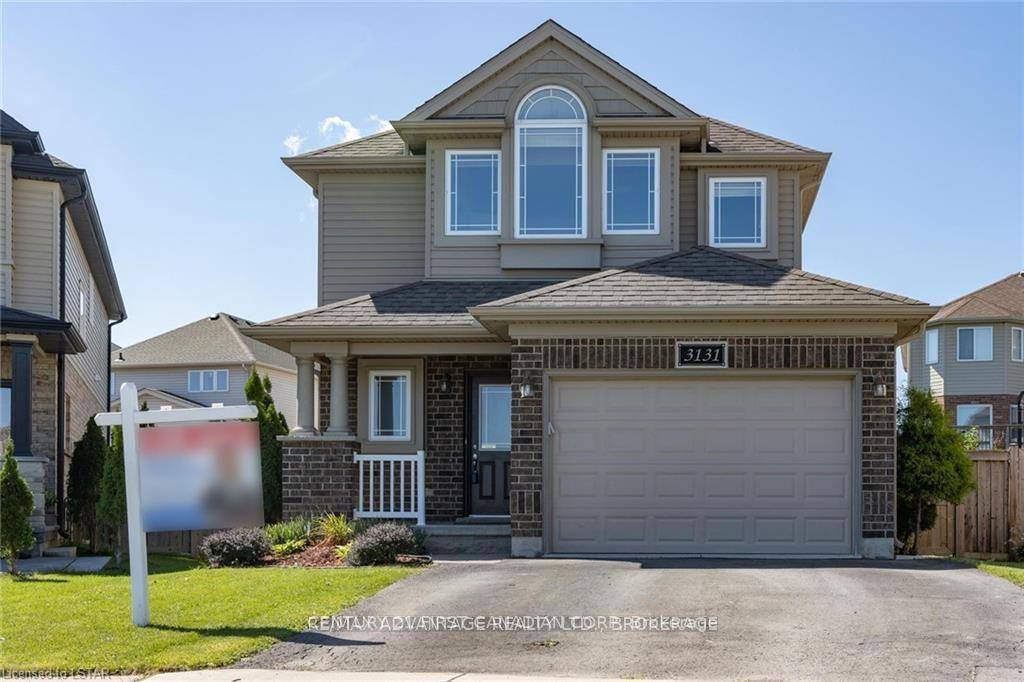This beautiful two storey home in the Longwoods area is a true gem, with a kitchen featuring rich espresso cabinetry, a large island, a pantry, stone backsplash, and under cabinet ...
