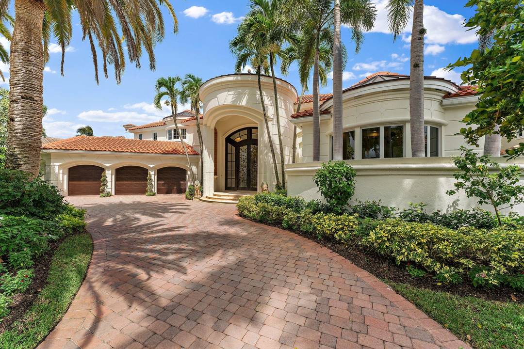 Rarely available stunning custom home in St Thomas at BallenIsles Country Club.