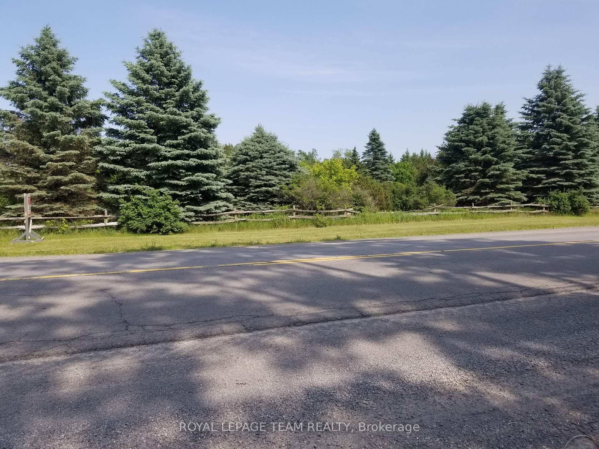 Remarkable wooded 2. 85 acre executive size lot Country setting with mature evergreens as planted by owner !