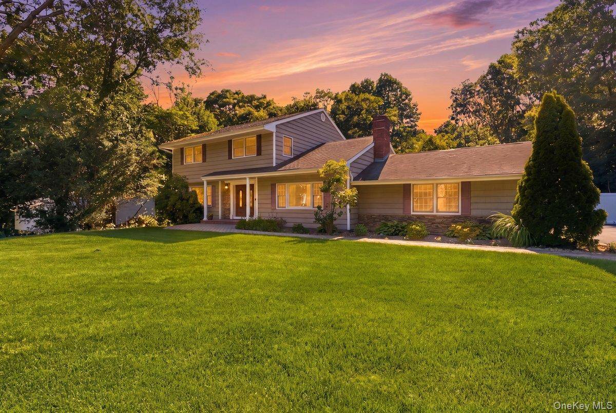 Welcome to 6 Redwood Drive, a beautifully maintained Center Hall Colonial nestled in the highly sought after Caledonia section of Dix Hills.