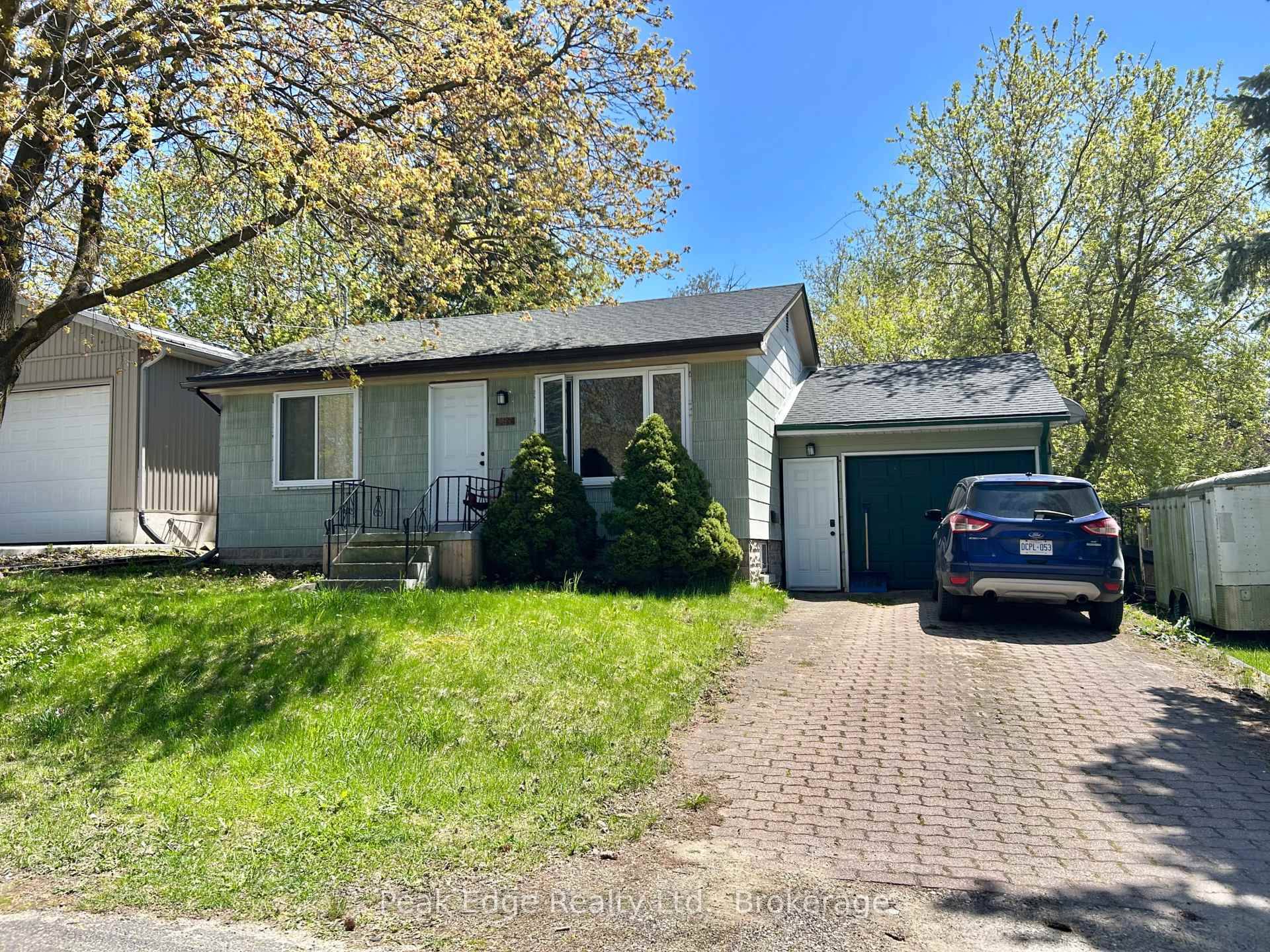 Check out this updated two bedroom bungalow with an attached garage.