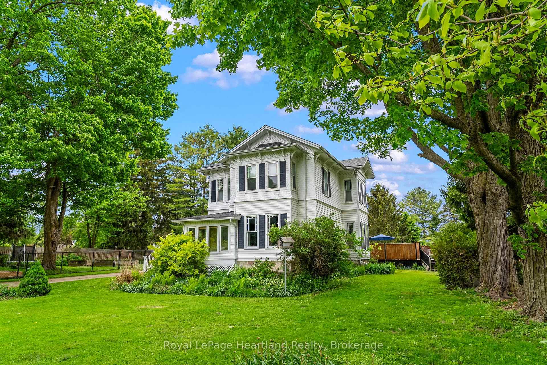 Step back in time and embrace the elegance of this stunning Victorian style two story home located in a picturesque setting directly across from the serene Maitland River.