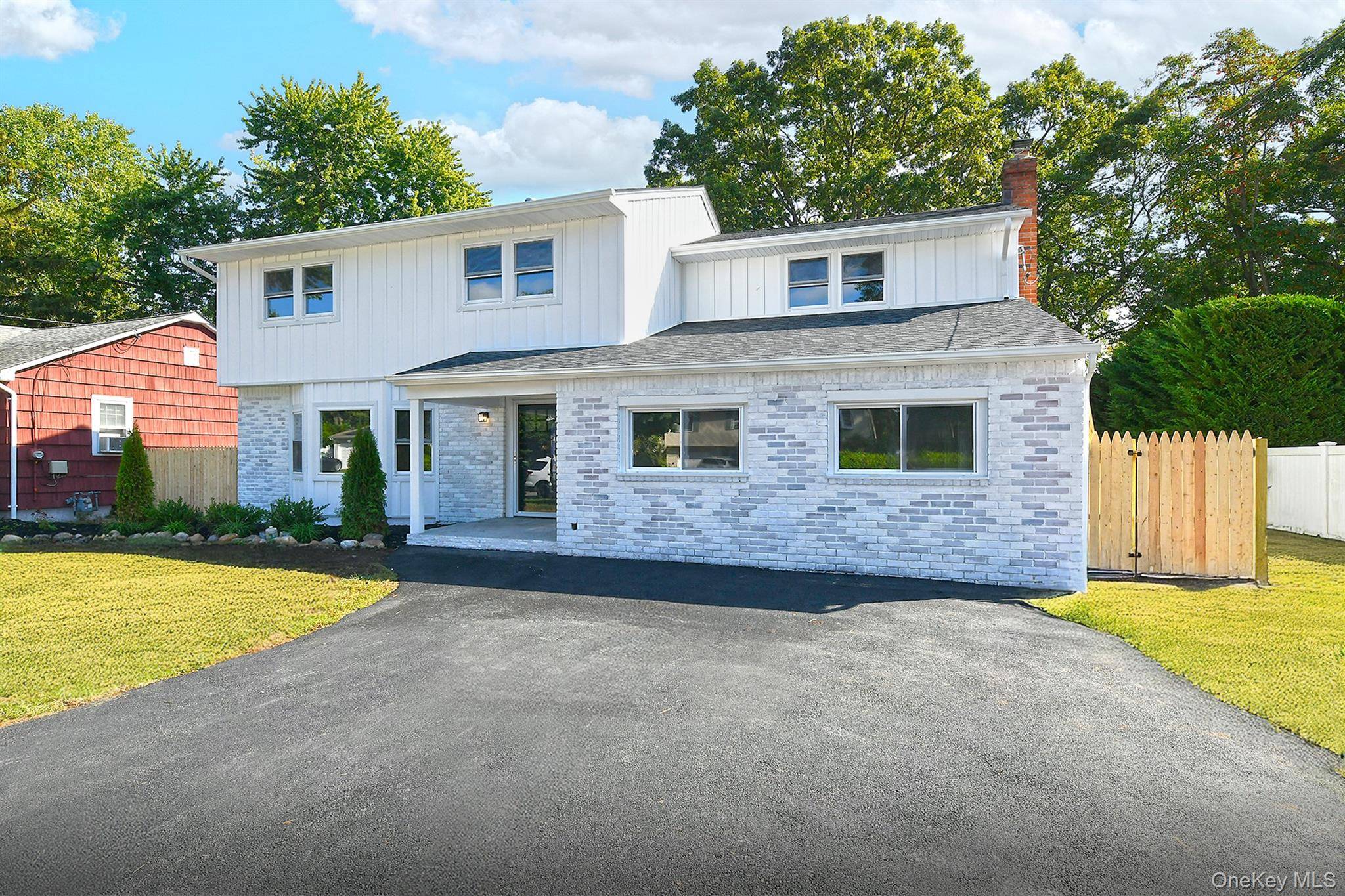 Welcome to 11 Cayuga Avenue, a beautifully renovated Colonial style home in the heart of Deer Park.