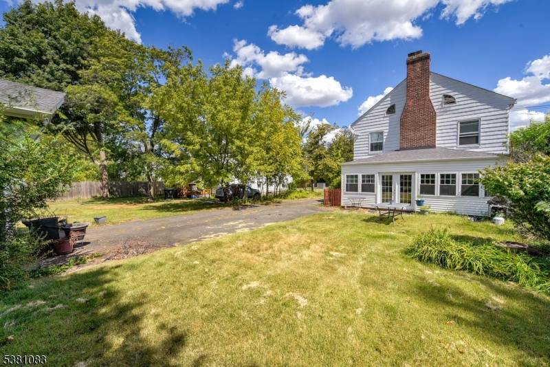 Charming 1935 Colonial filled with old world character and timeless appeal !