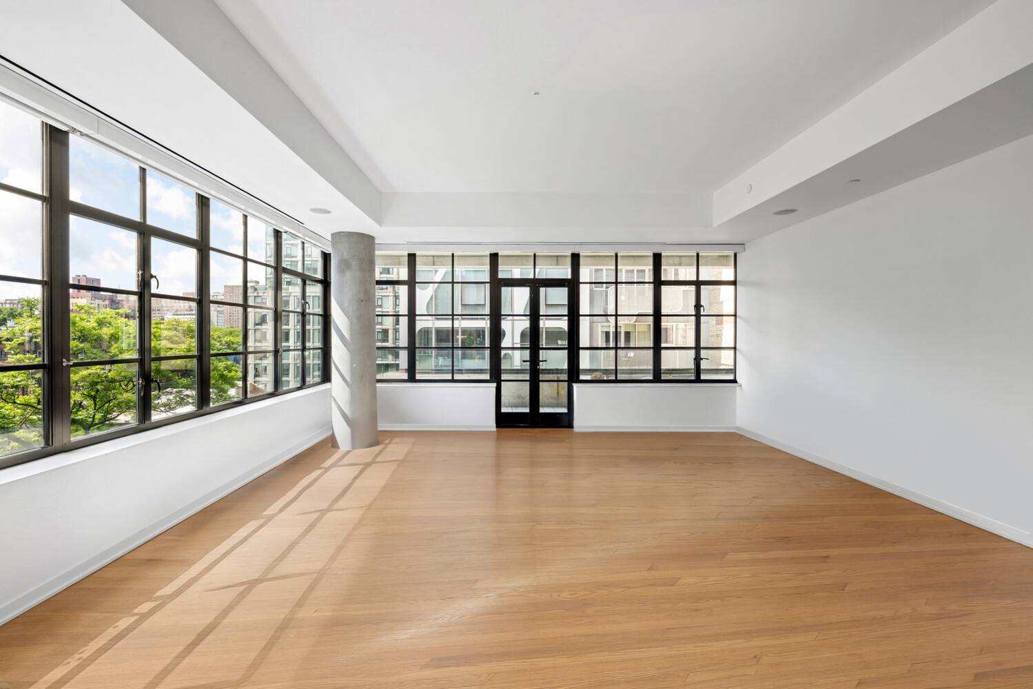 Enjoy luxurious, modern Chelsea loft living with Empire State Building and High Line views in this dazzling corner condo with private outdoor space.