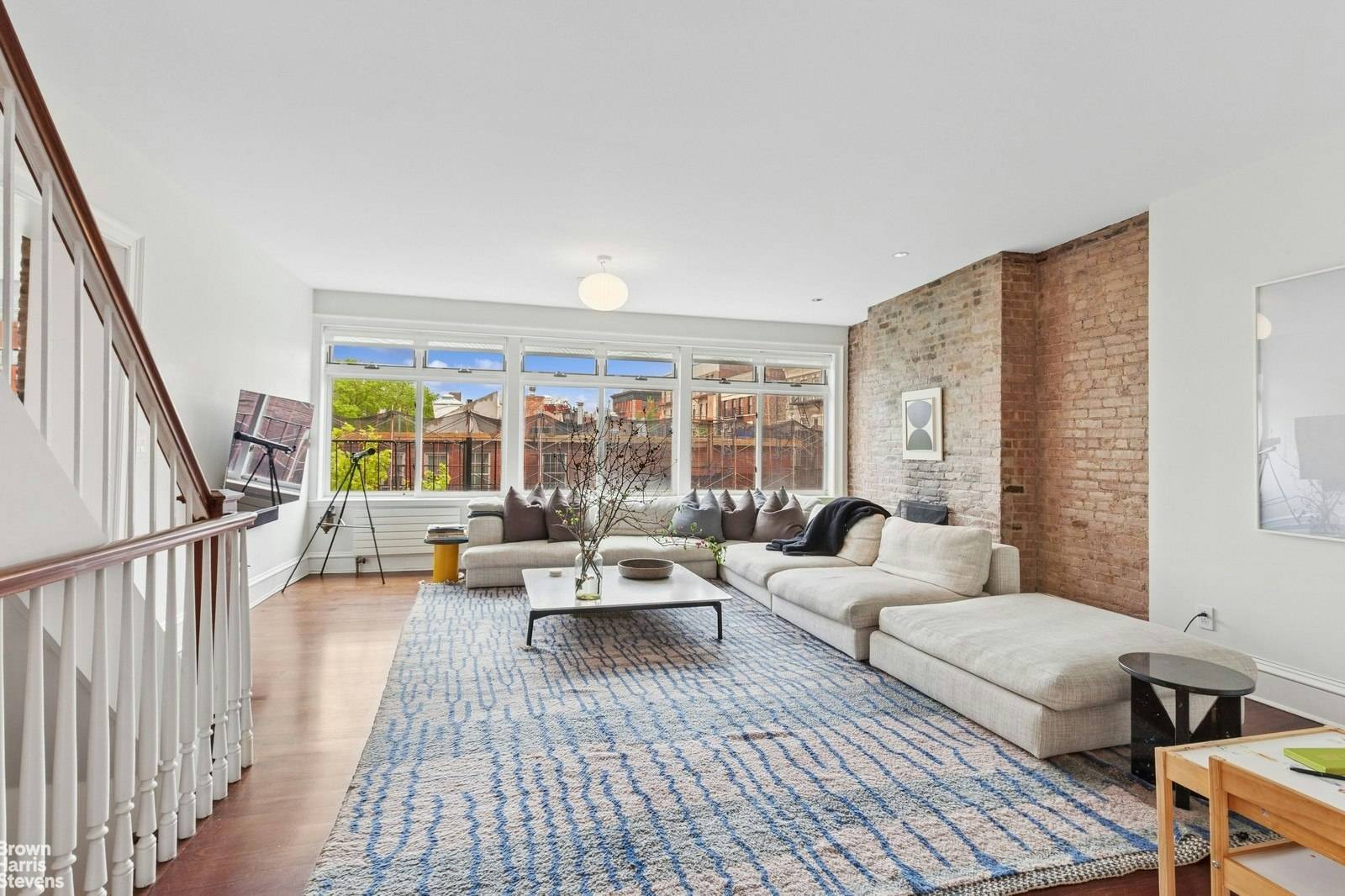 This 1829 four story townhouse is situated on a tree lined, cobble stone street in the landmark district of West Village.
