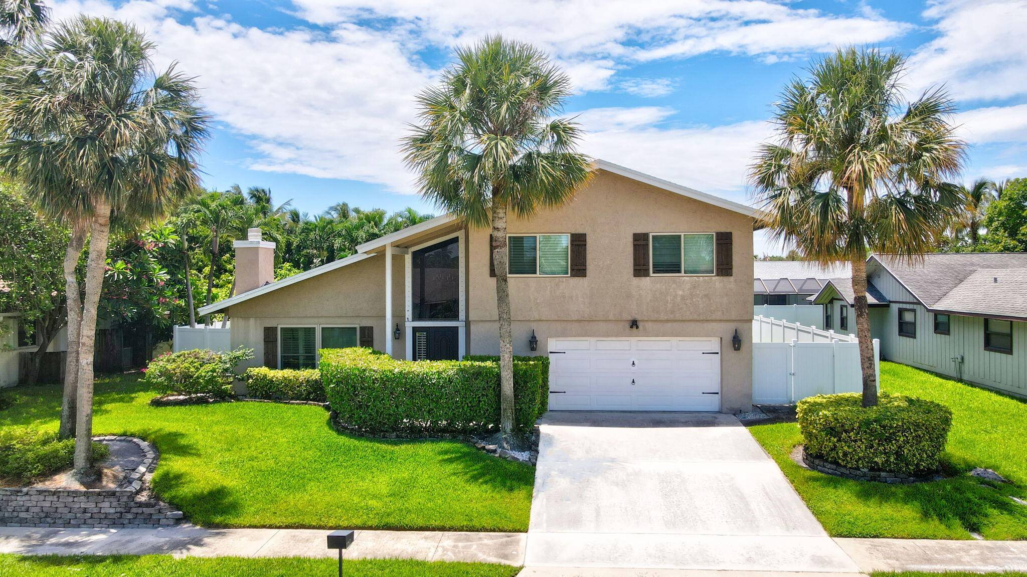 Discover this exceptional home in the highly sought after East Boca's Pinelands North with no HOA.