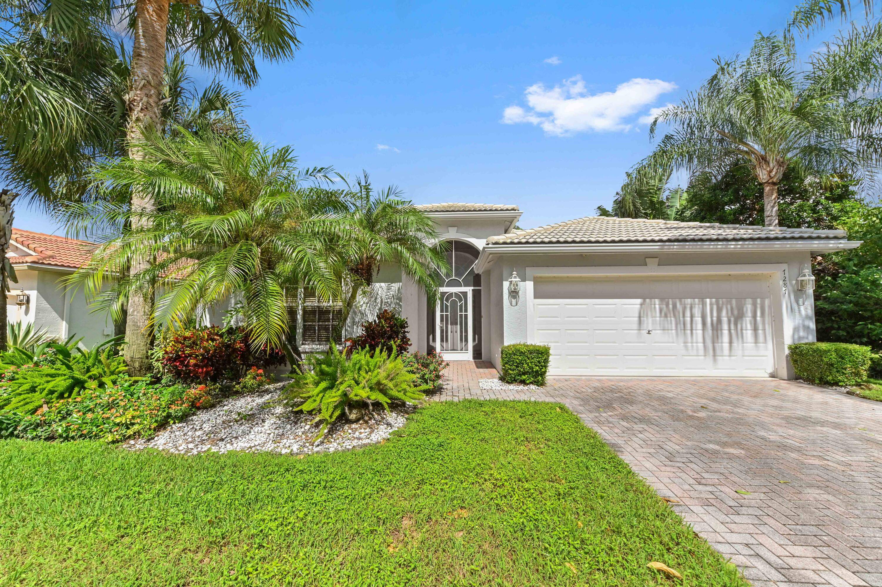 Introducing 7287 Wailea Ave, Boynton Beach an elegant Coral model home in a tranquil lakefront setting, perfectly located away from the city's hustle but still easily accessible.